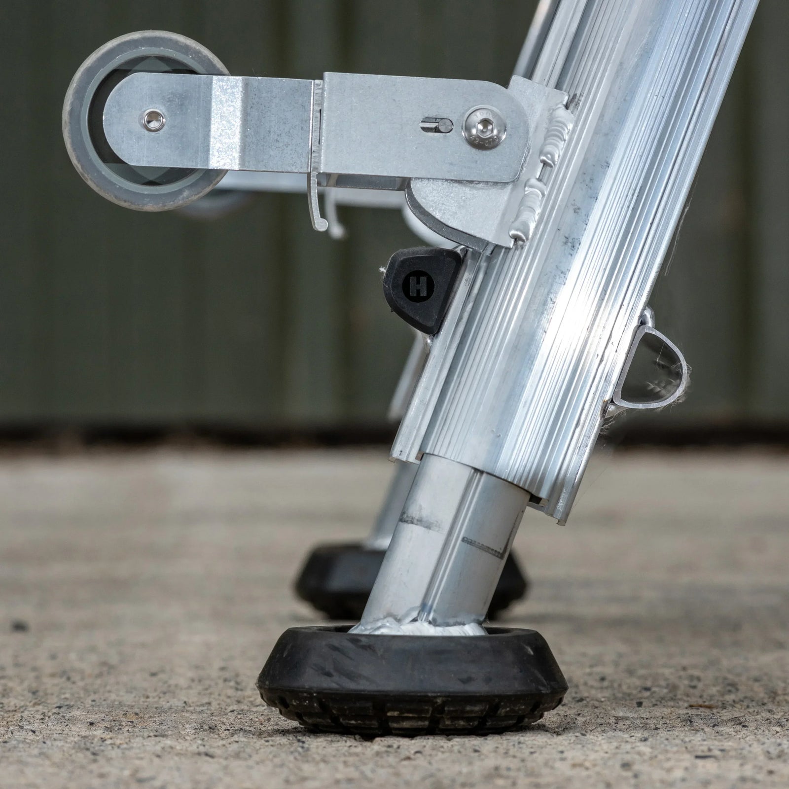 a close up of the feet and wheels at the base of the platform