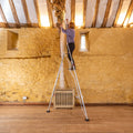 Rear Adjustable Leg Tripod Ladder - being used indoors