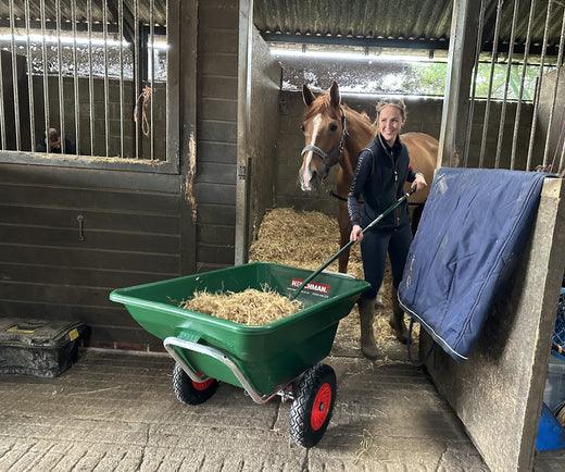 Henchman wheelbarrow filled with hay