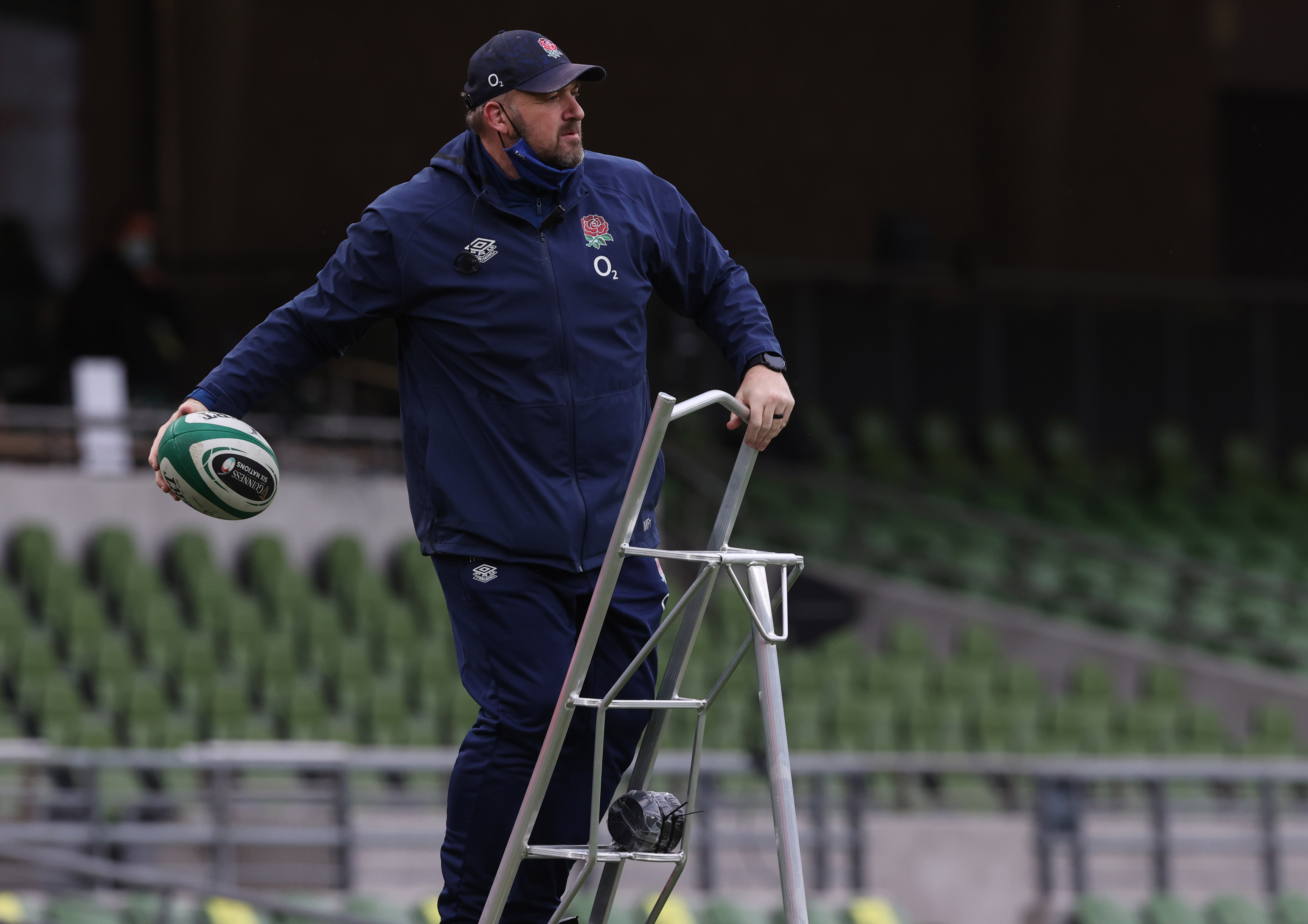England Rugby coach standing on tripod ladder